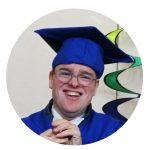 a young man in a graduation cap and gown