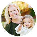 a woman and a young girl smiling