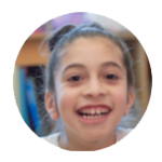 a young girl smiling