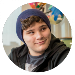 a boy in a beanie hat