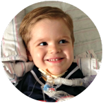 a young boy with a trach tube